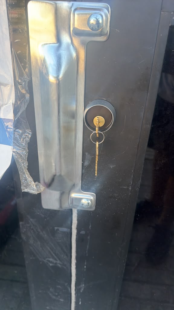 Fast Local Locksmith technician rekeying a door lock at a Dallas-area home