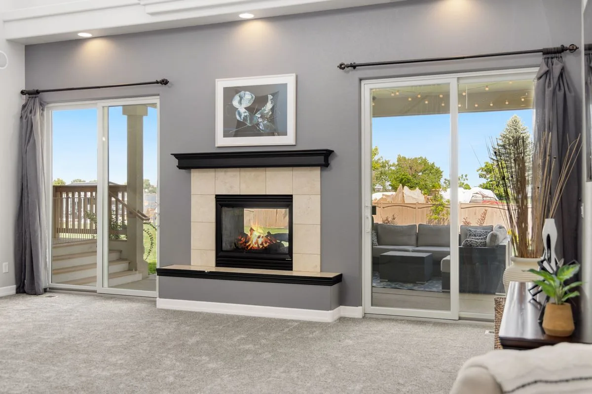 Sliding glass doors leading from a living room to a patio