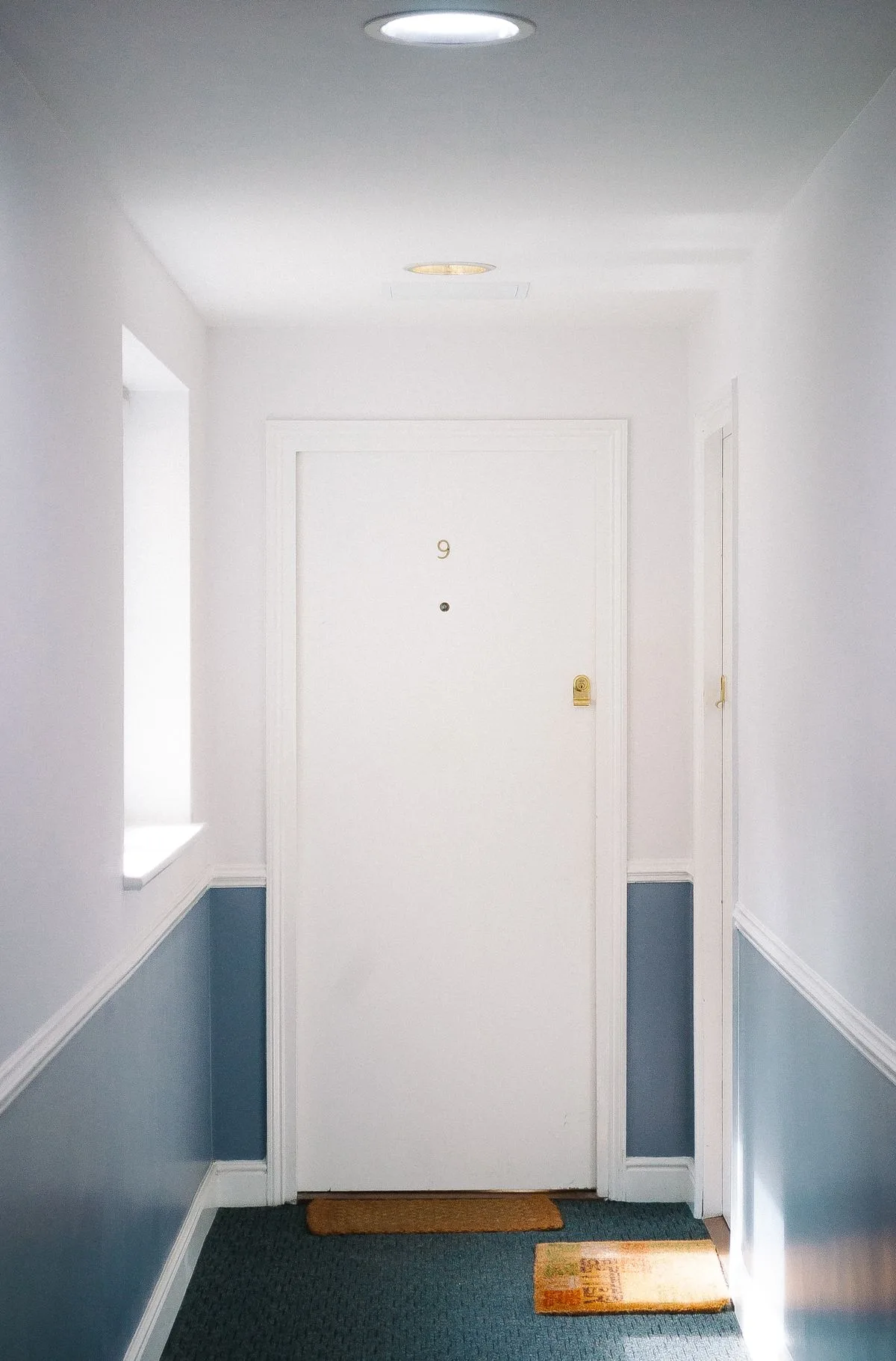 Apartment hallway with a numbered unit door