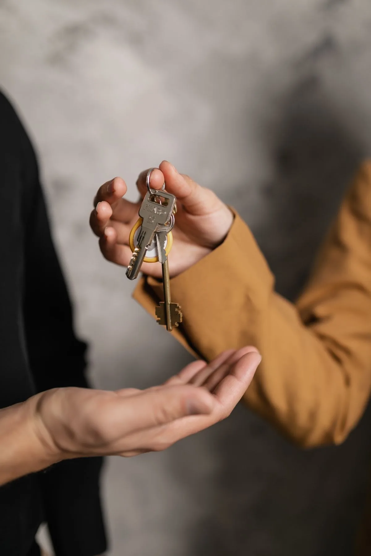 Keys being handed over to a new tenant for a rental unit